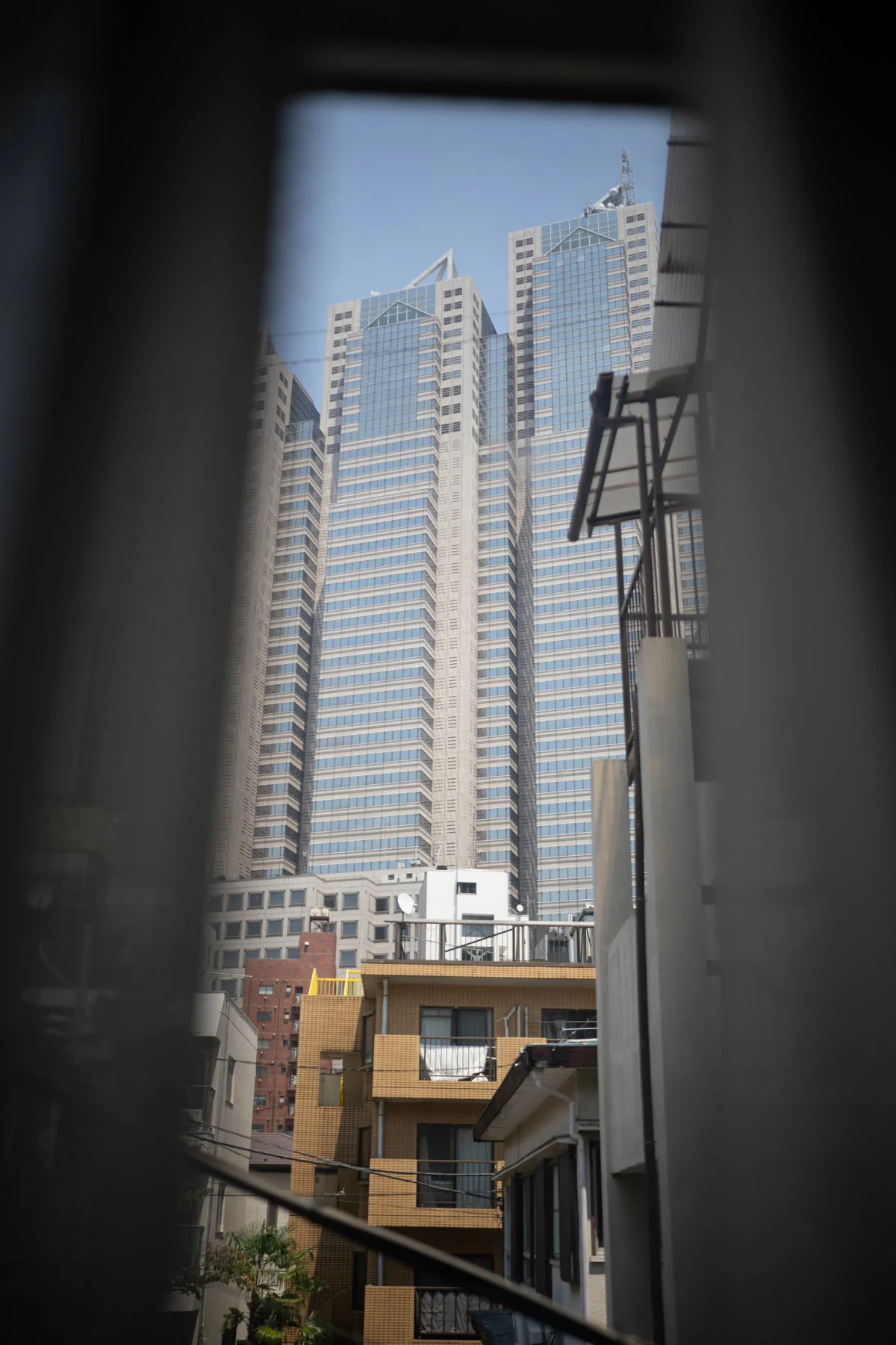 Shinjuku towers through a window
